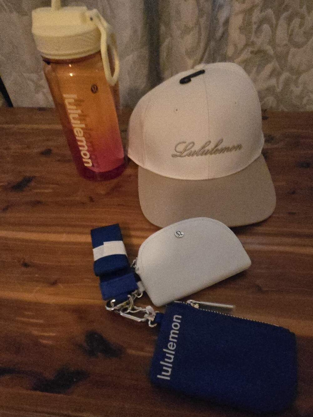 lululemon athletica Beige cap with tan brim, navy blue pouch & orange bottle set